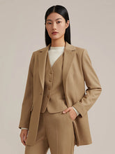 a woman in camel blazer